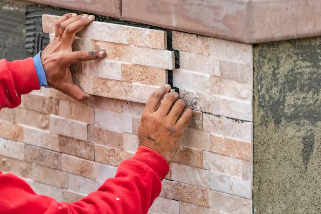 pool builder installing pool tiles