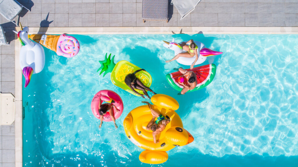 friends swimming with giant float pool accessories for adults