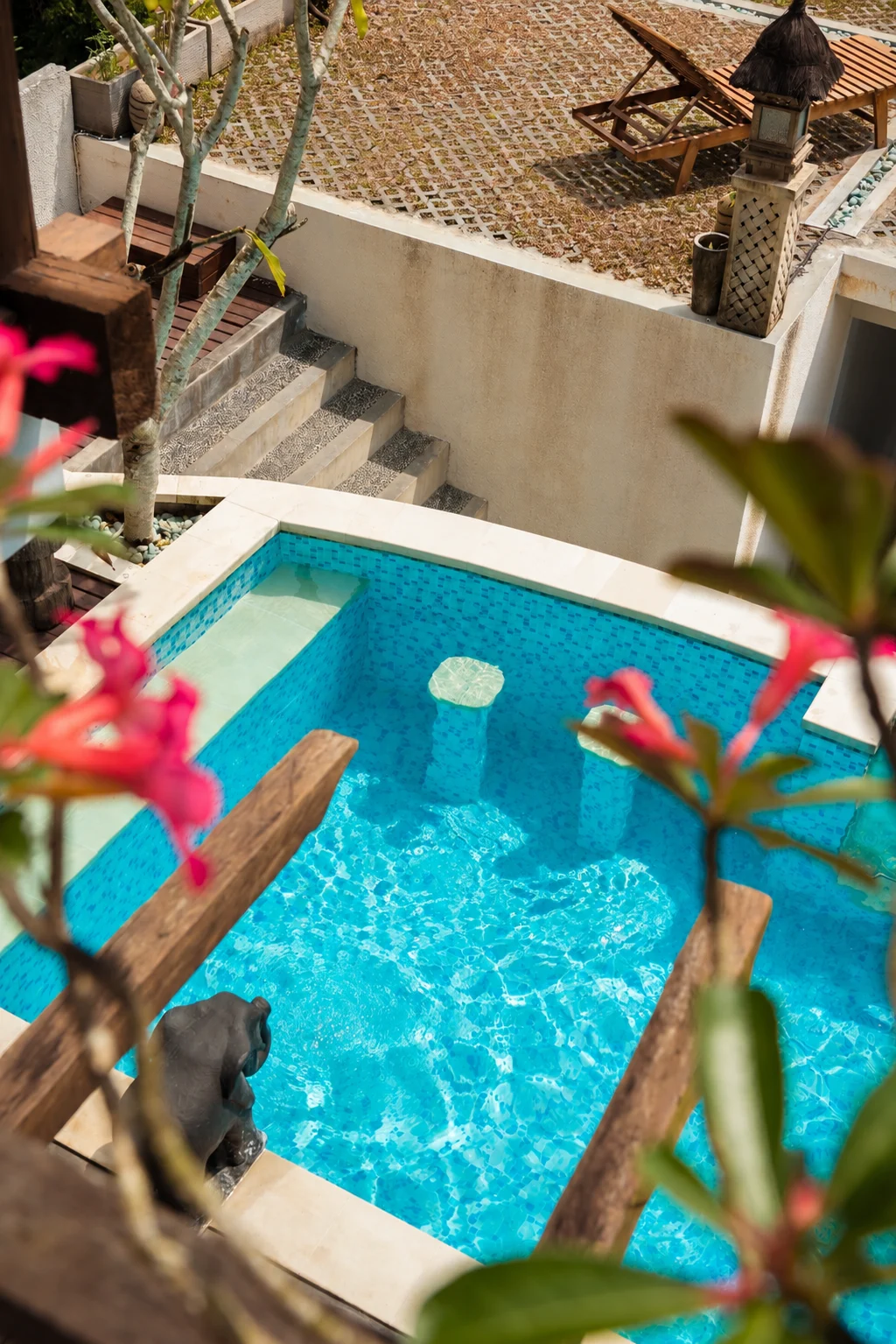 Pool Builder Serving Southern California, Southern Utah and Arizona 8 Above-ground swimming pool in a landscaped California backyard with turquoise water, stone coping, and surrounding outdoor features
